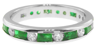 Platinum channel set diamond and emerald band.