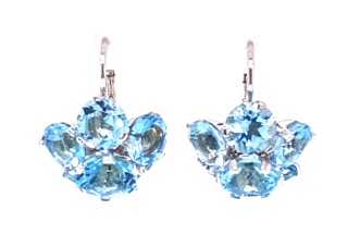 14kt white gold blue topaz flower style hanging earrings.