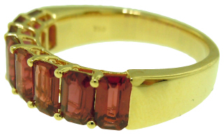 18kt yellow gold shared prong emerald cut ruby band.
