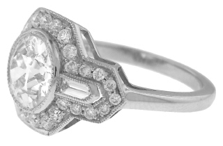 Platinum round and baguette diamond ring