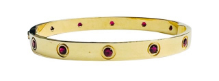 18kt yellow gold ruby screw bangle bracelet.