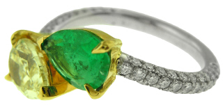 Platinum and 18kt yellow gold pear shape emerald and pear shape yellow diamond ring