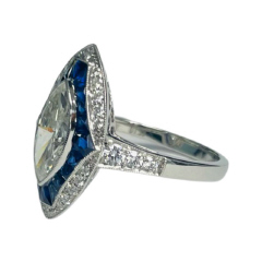 Platinum marquise, round and sapphire ring