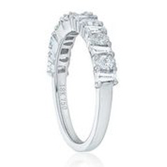 18kt white gold tapered baguette and pear shape diamond band.