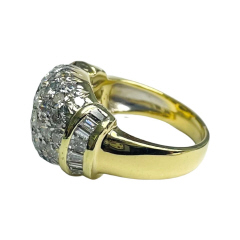 18kt yellow gold round and baguette diamond ring.
