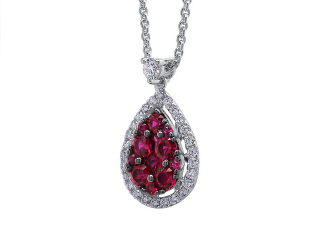 18kt white gold ruby and diamond pendant with chain.