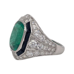 Platinum emerald, black onyx and diamond ring.