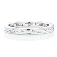 Platinum channel set baguette diamond eternity band.