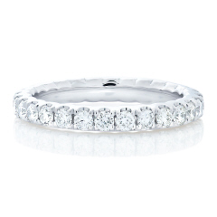 Platinum split prong "U" style diamond eternity band.