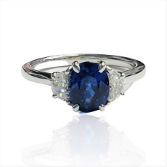 18kt white gold oval sapphire and half moon diamond ring