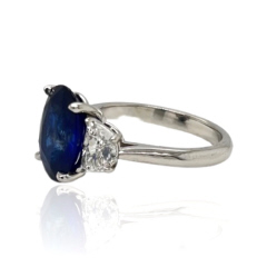 Platinum oval sapphire and half moon diamond ring