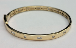 14kt yellow gold diamond bangle bracelet.