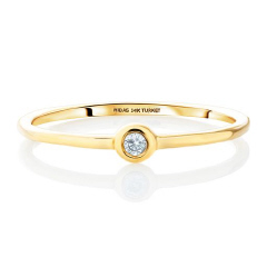 14kt yellow gold bezel set round diamond dainty band.