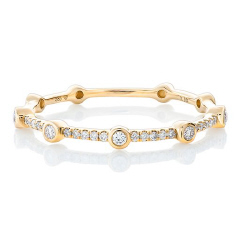 14kt yellow gold diamond band with bezel set diamonds.