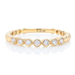 14kt yellow gold bezel set diamond band.