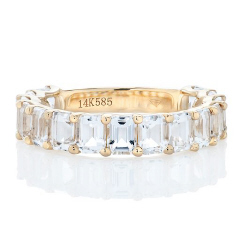 14kt yellow gold emerald cut white topaz band.