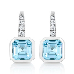 14kt white gold bezel set blue topaz and diamond earrings