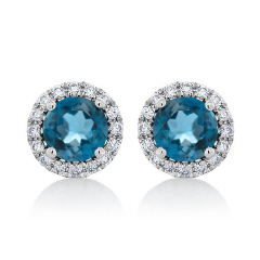 14kt white gold London blue topaz and diamond halo stud earrings.
