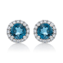 14kt white gold London blue topaz and diamond halo stud earrings.