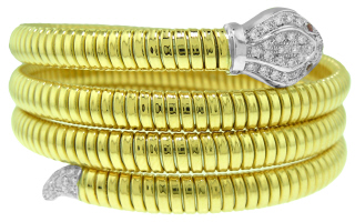 18kt two-tone 3-row serpentino diamond bangle bracelet.