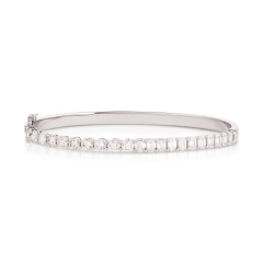 18kt white gold 1/2 emerald cut and 1/2 round diamond bangle bracelet.