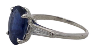 Platinum oval sapphire and baguette diamond ring