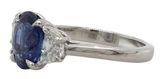 Platinum oval sapphire and half moon diamonds ring