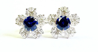 18kt white gold sapphire and diamond flower earrings.