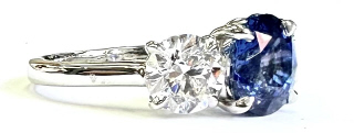 18kt white gold sapphire and diamond 3 stone ring.