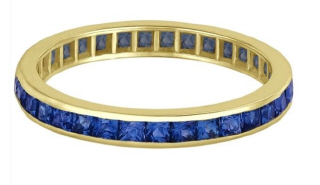 18kt yellow gold channel set sapphire eternity band.