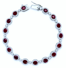 18kt white gold oval ruby and diamond bracelet.