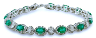 18kt white gold oval emerald and diamond bracelet.