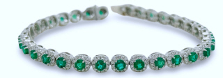 18kt white gold emerald and diamond bracelet.