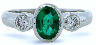 18kt white gold bezel set emerald and diamond 3 stone ring