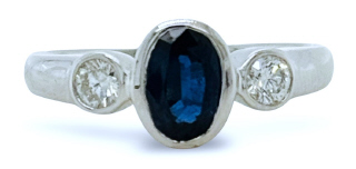 18kt white gold bezel set sapphire and diamond 3 stone ring