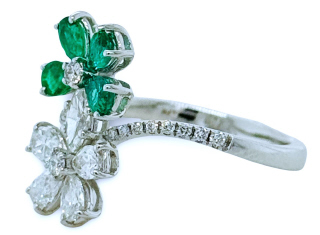 18kt white gold emerald and diamond bypass flower ring