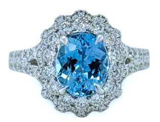 18kt white gold halo style aqua and diamond ring.