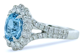 18kt white gold halo style aqua and diamond ring.