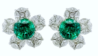 18kt white gold emerald and diamond flower earrings.