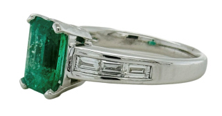 18kt white gold/ Platinum emerald and diamond ring.