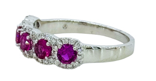 18kt white gold ruby and diamond halo style band.