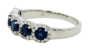 18kt white gold sapphire and diamond halo style band.