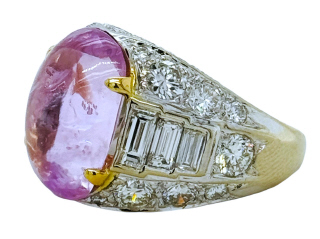 18kt white gold oval cabachon pink sapphire, round and baguette dimaond ring