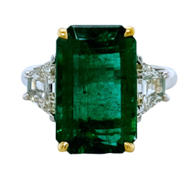 Platinum/18kt yellow gold emerald and diamond ring.