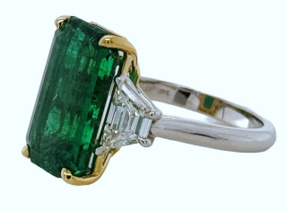 Platinum/18kt yellow gold emerald and diamond ring.