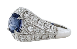 Platinum sapphire and diamond ring with milgrain finish.