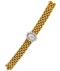 Ladies 18kt yellow gold 7" Quartz bracelet watch with diamonds and MOP diamond dial.