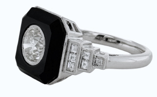 Platinum black onyx and diamond ring.