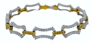 18kt two tone white and yellow diamond link bracelet.