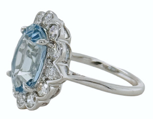 18kt white gold oval aquamarine, round and pearshape diamond halo ring
